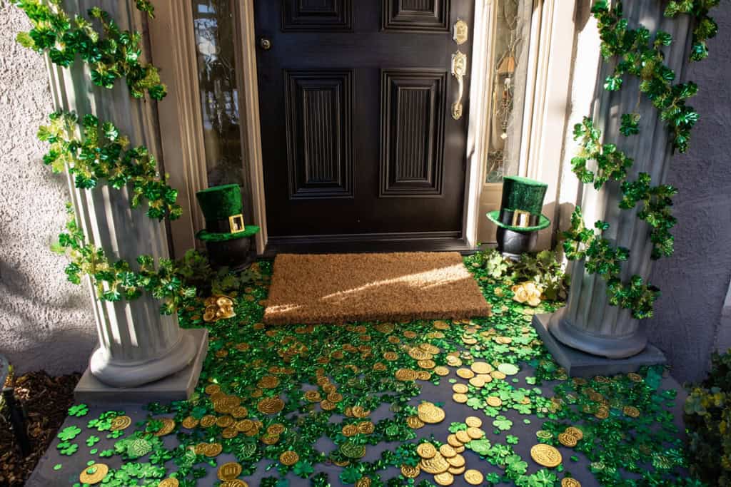 Entrance to the front door with Irish green hats and shamrocks lining the pathway.